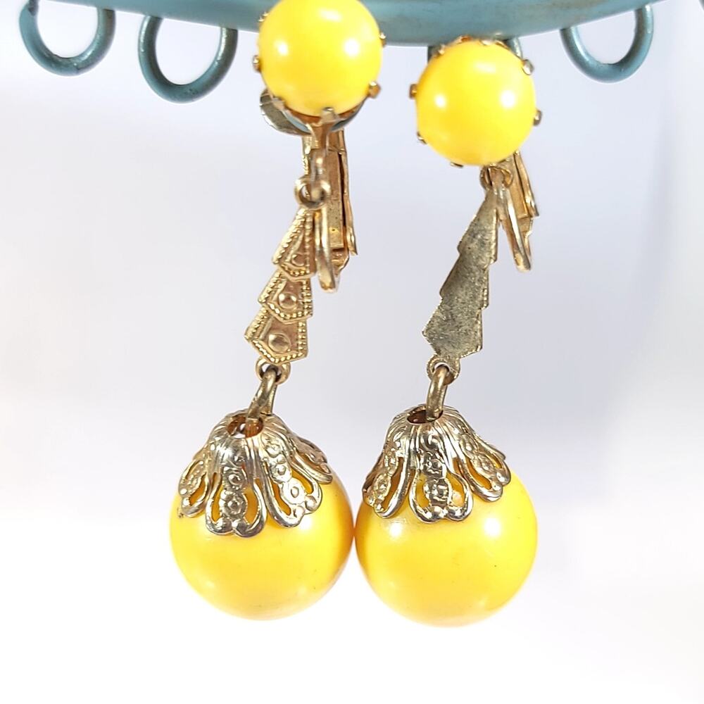 Vintage Yellow Clip-on Earrings with Goldtone Accents, Retro Dangle Design